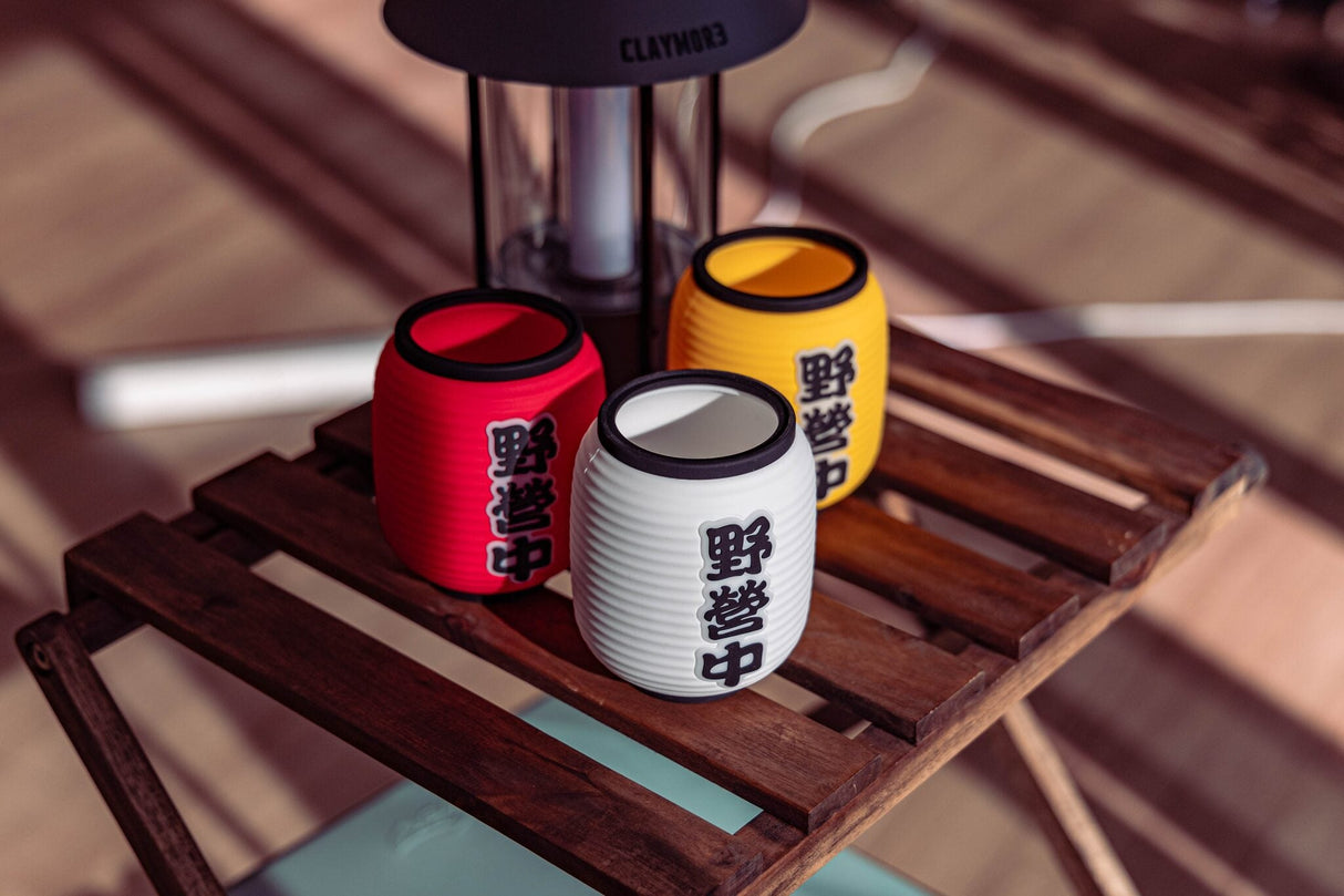 CLAYMORE IZAKAYA SHADE three-colour set on a camp table